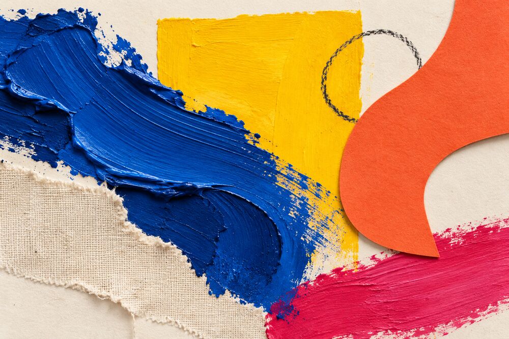 Colorful abstract collage of bold blue, yellow, and pink paint strokes with cut paper and torn canvas