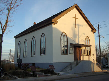 Salem Chapel, a white historic church with arched windows and a cross on its gable, in St. Catharines, Ontario